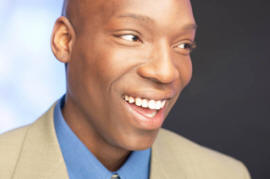 Antoine is smiling about his new job.